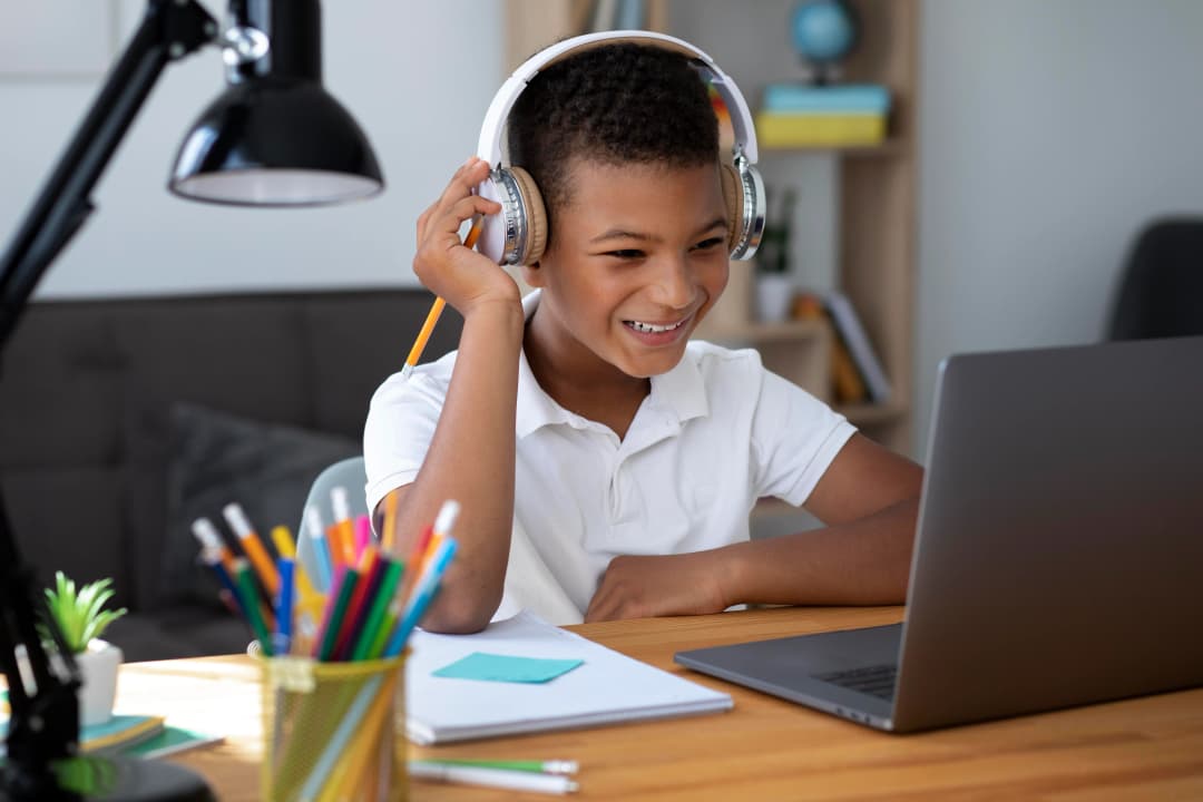 Young student learning on laptop