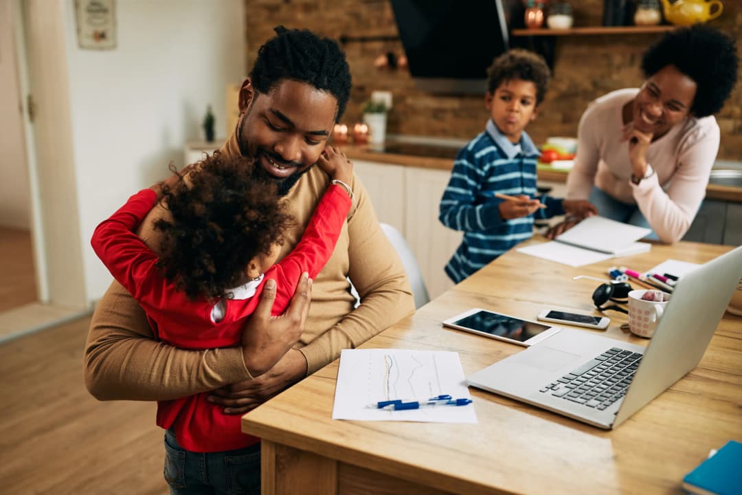 Mother helping child learn online